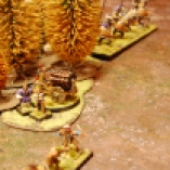 Fredrik pushes his Hellblaster through the woods and re-deploys it within range of the entire Dwarven line, giving Herman one choice: to let his troops take a volley, or respond with his own artillery in the following turn.
