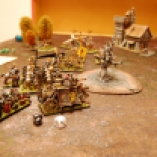 The Demigryphs charge in to finish off the Gyrocopter on the far side of the battlefield, while the Empire's right flank is slowed down due to precise Dwarven fire!